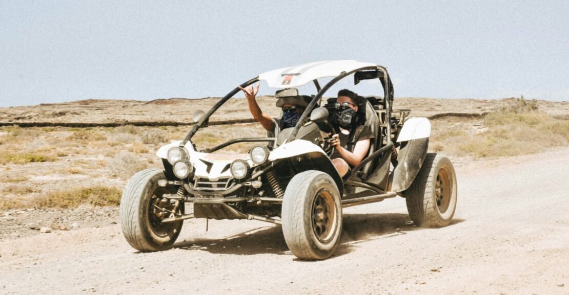 man riding UTV on road